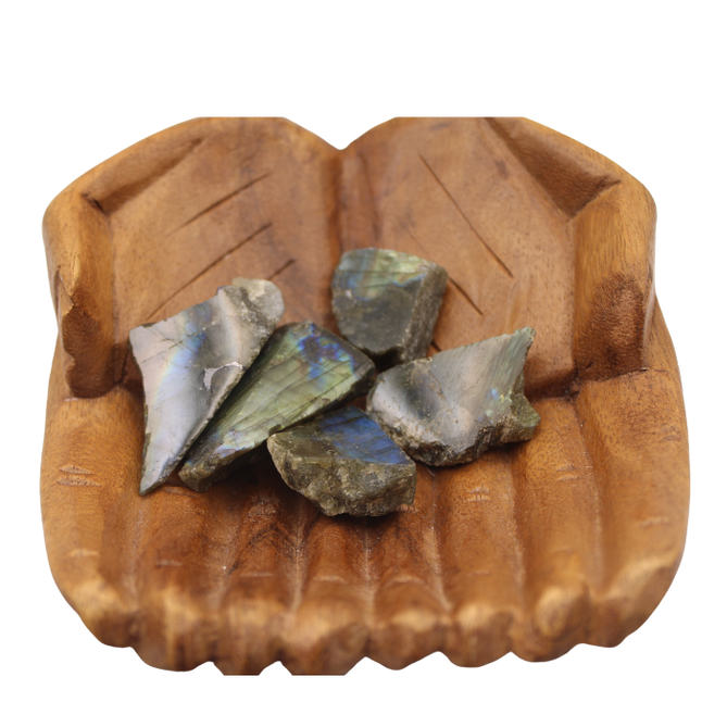 Rough labradorite nuggets on a wooden display piece