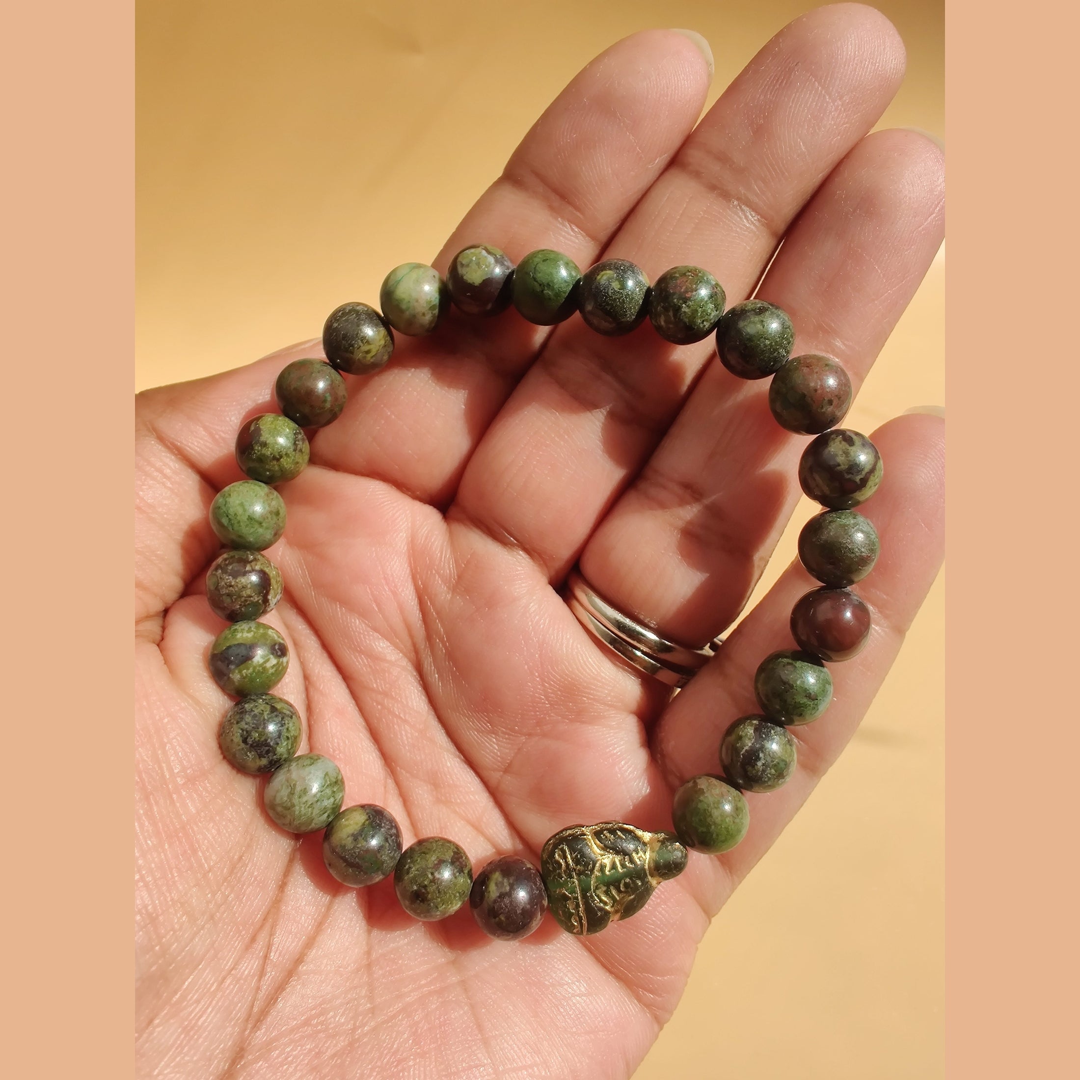 Cuprite and dragon blood jasper (A) stretch bracelet with Czech glass Buddha spacer image 1