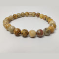 Faceted yellow crazy lace agate and picture jasper stretch bracelet with gold plated groove barrel bead slide image 0