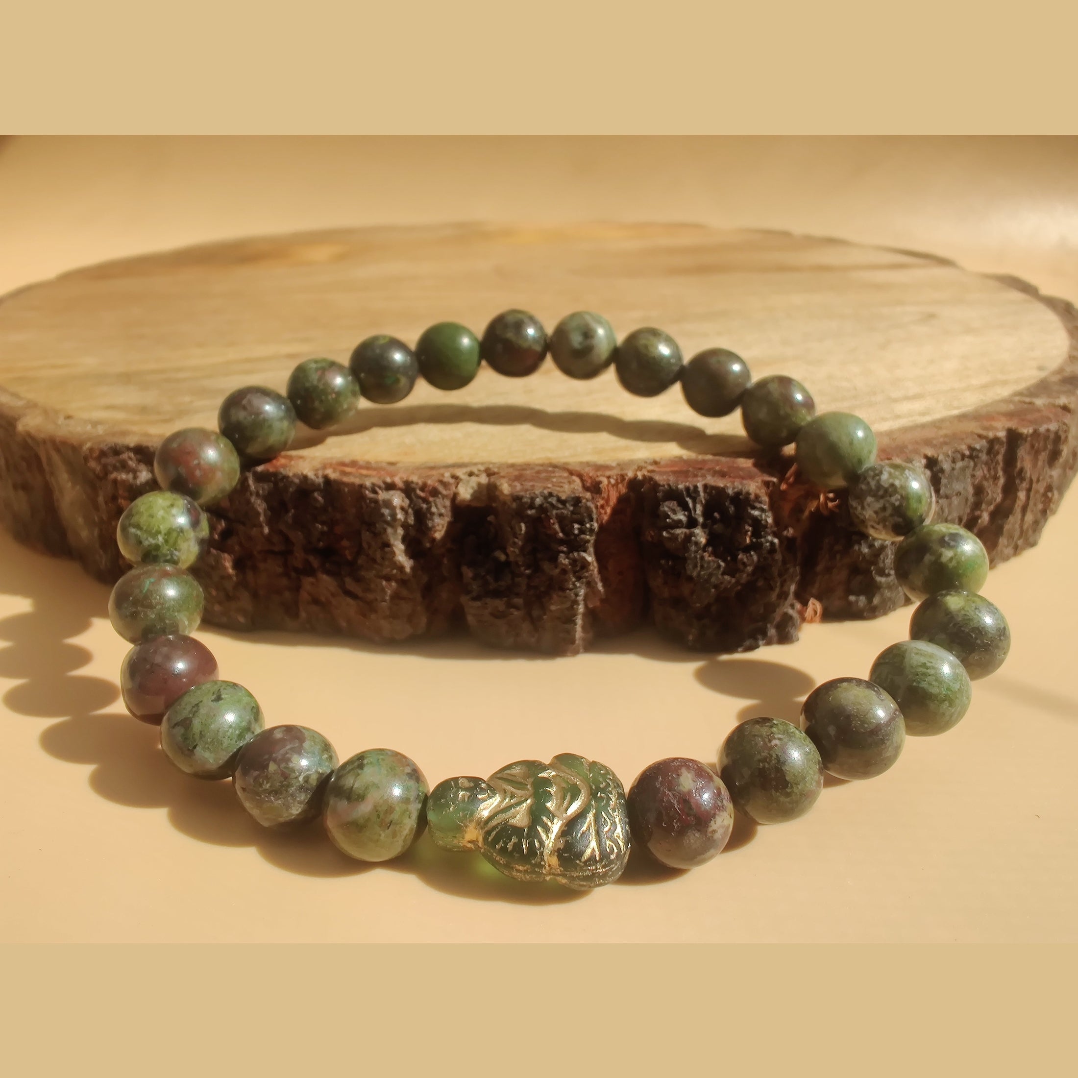 Cuprite and dragon blood jasper (A) stretch bracelet with Czech glass Buddha spacer image 0