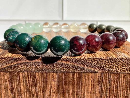Bloodstone, citrine (A), garnet, green aventurine, and pyrite stretch bracelet